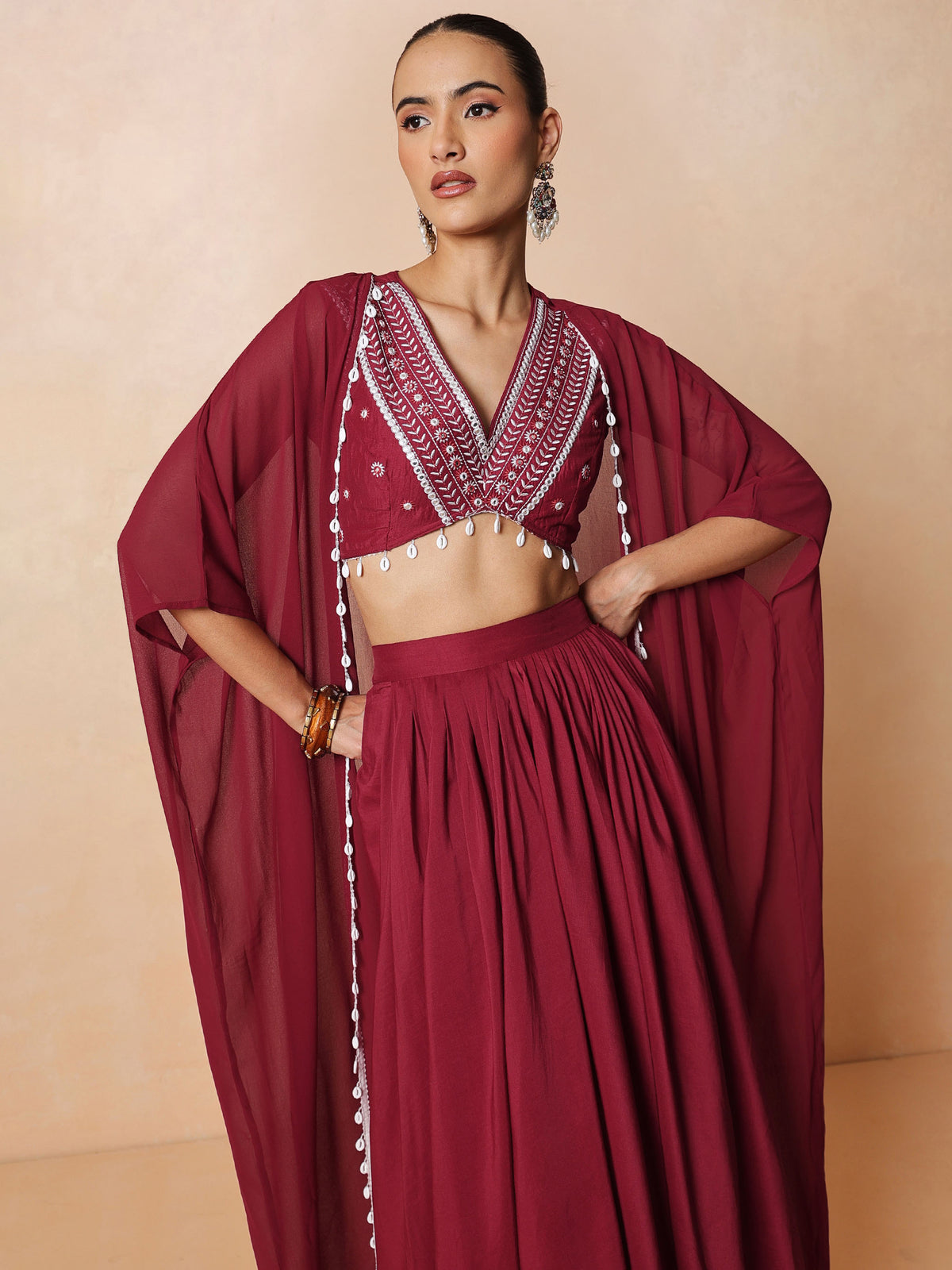 Maroon Embroidered Crop Top With Dhoti Skirt And Shrug-Shae by SASSAFRAS