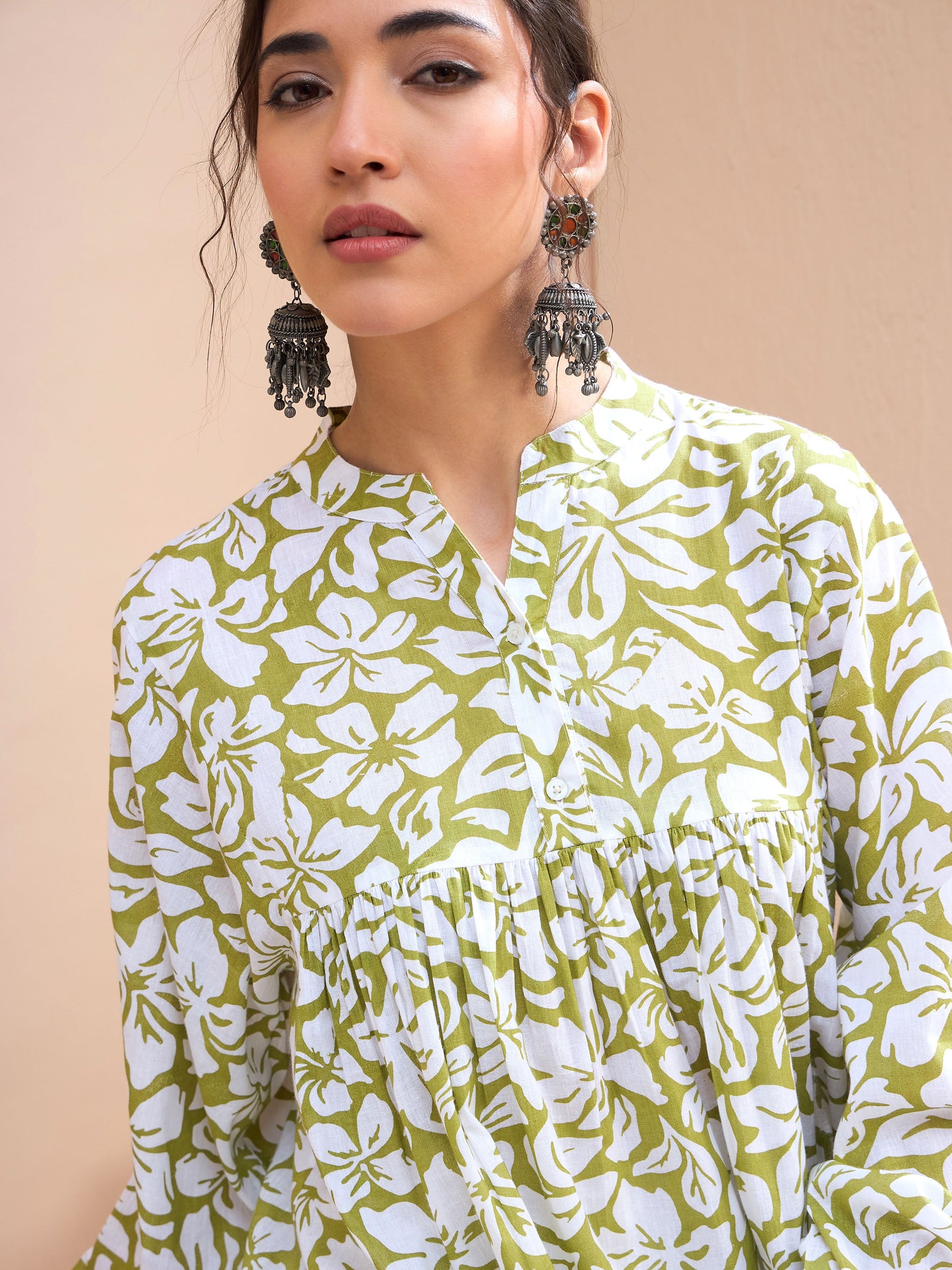 Green Floral Cambric Sleeves Knot Peplum Kurti-Shae by SASSAFRAS