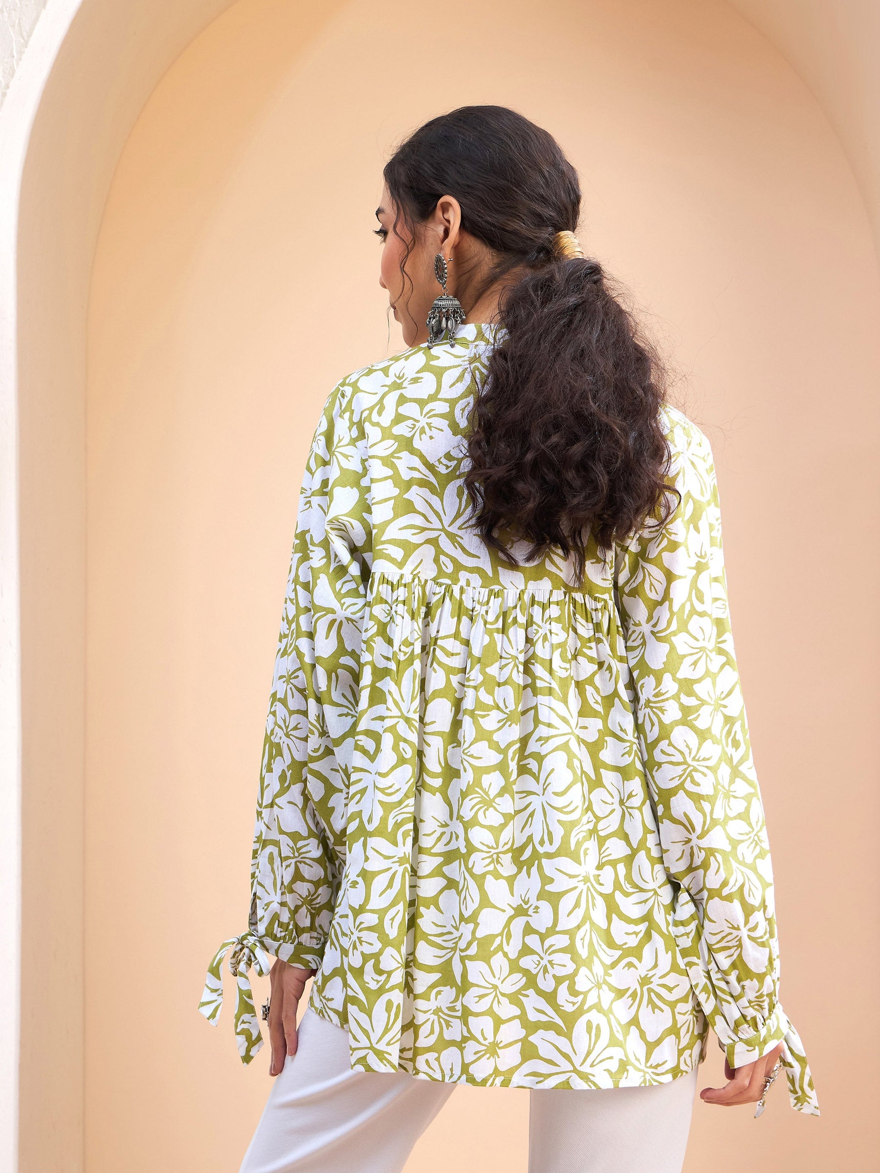 Green Floral Cambric Sleeves Knot Peplum Kurti-Shae by SASSAFRAS