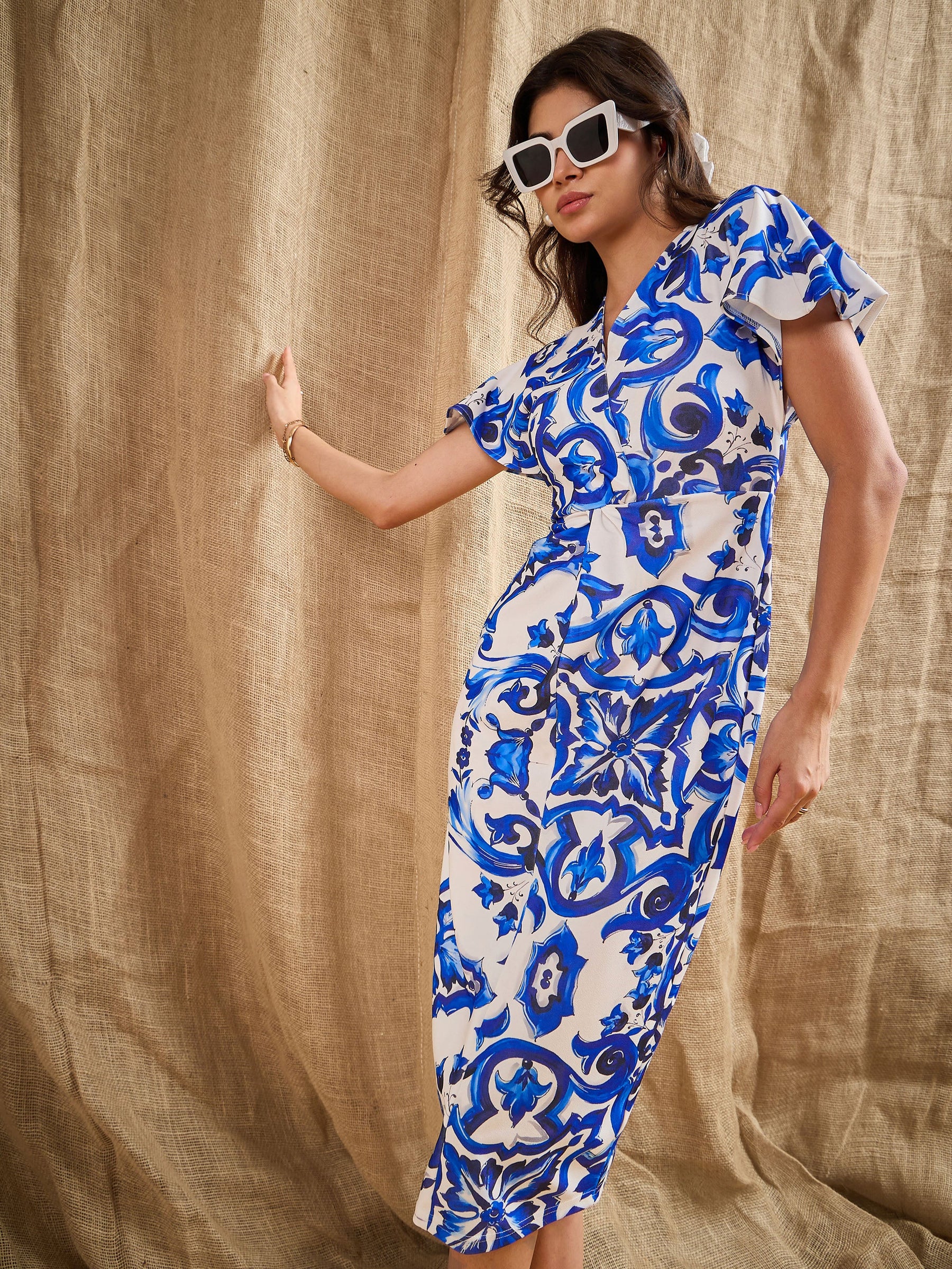 Buy Women Blue Printed V-Neck Bodycon Dress Online at Best Price - Sassafras Buy Women Blue Printed V-Neck Bodycon Dress Online at Best Price - Sassafras