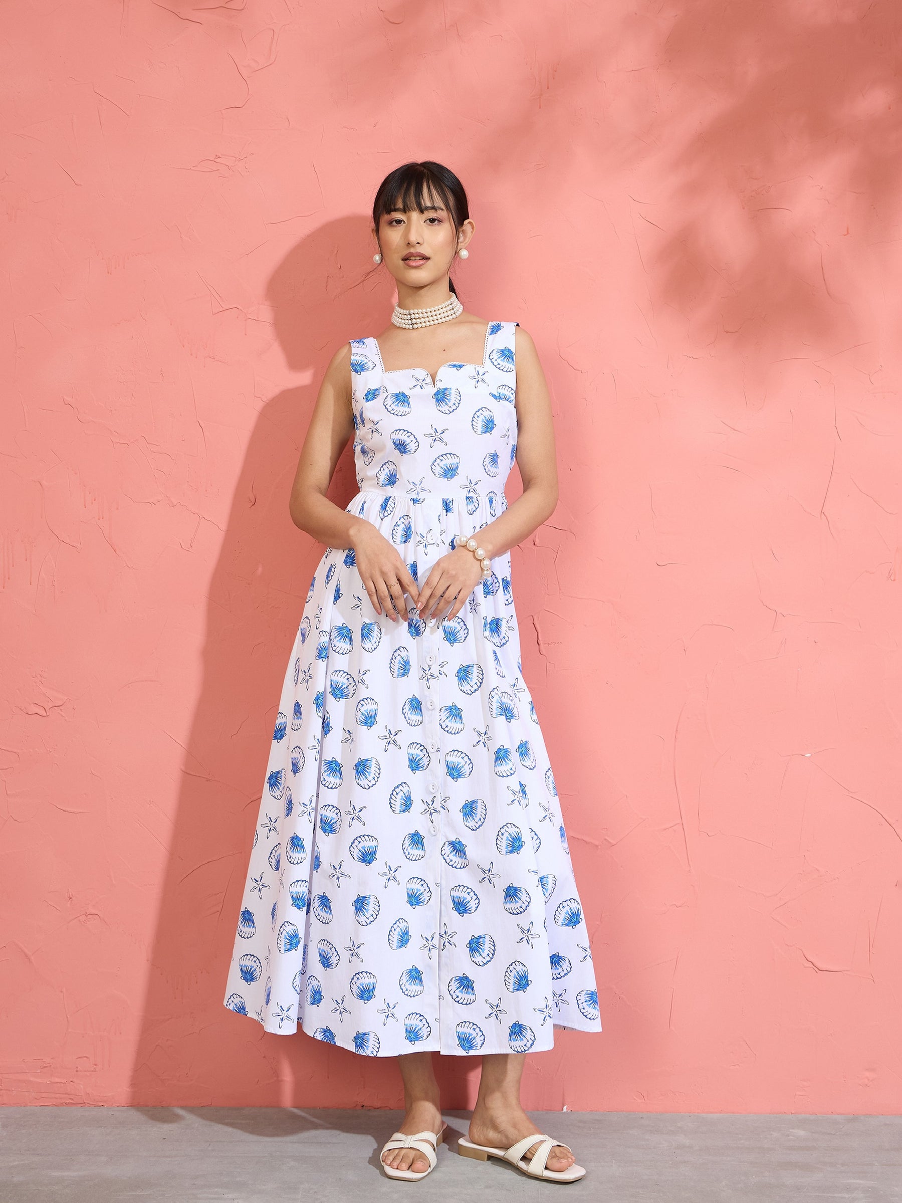 Women White & Blue Printed Sleeveless Button Down Midi Dress