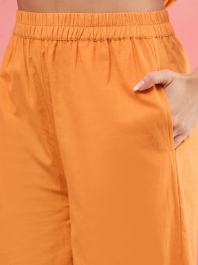 Women Rust Schiffli Sleeveless Peplum Top With Straight Pants