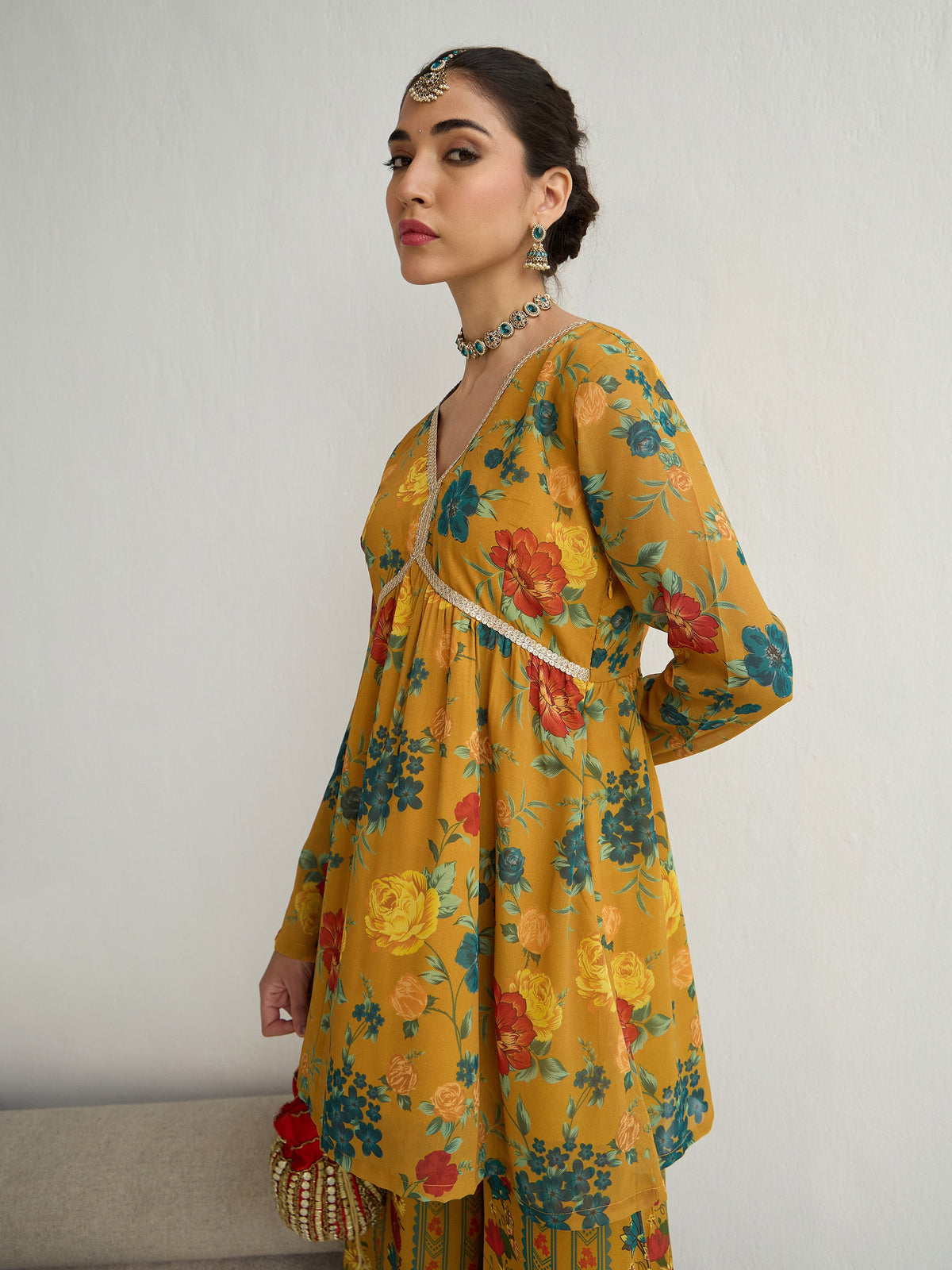 Mustard Floral Peplum Top With Bais Flared Sharara-Shae by SASSAFRAS