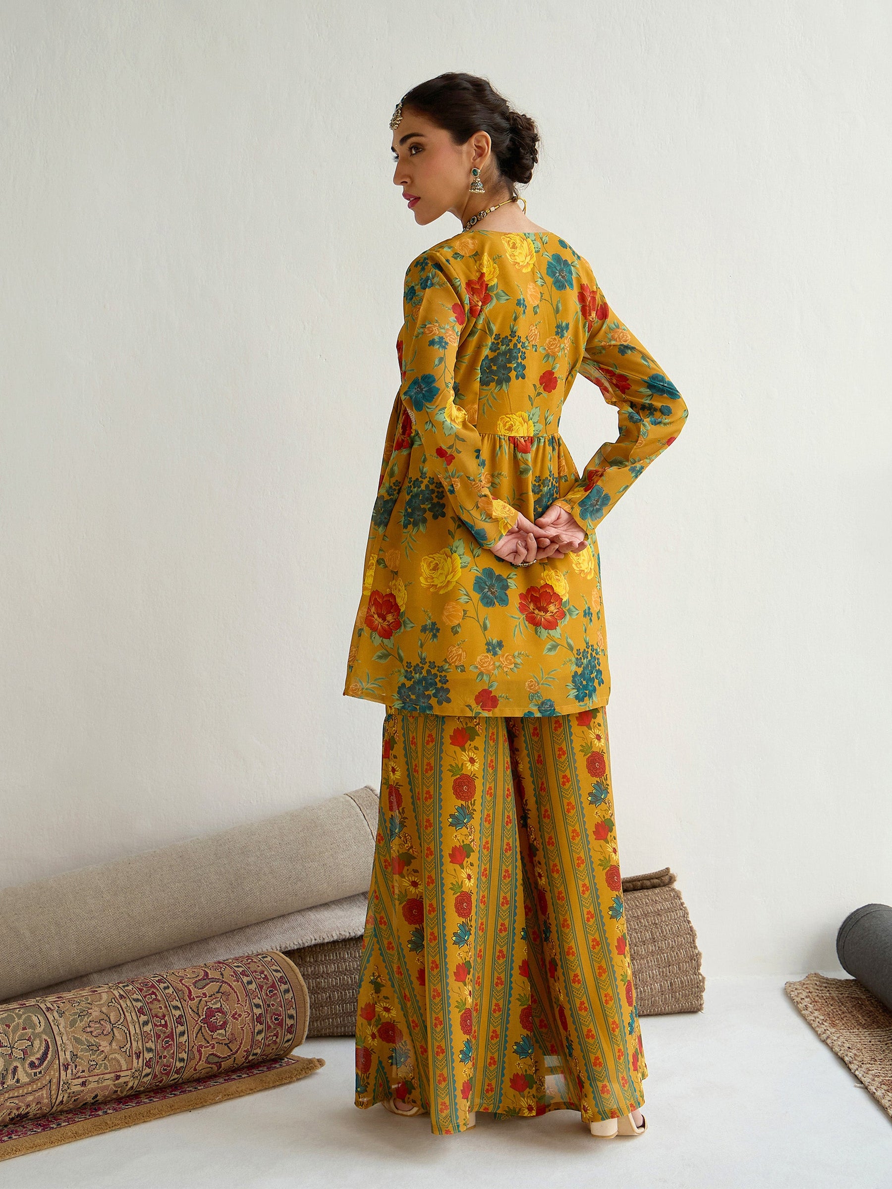 Mustard Floral Peplum Top With Bais Flared Sharara-Shae by SASSAFRAS