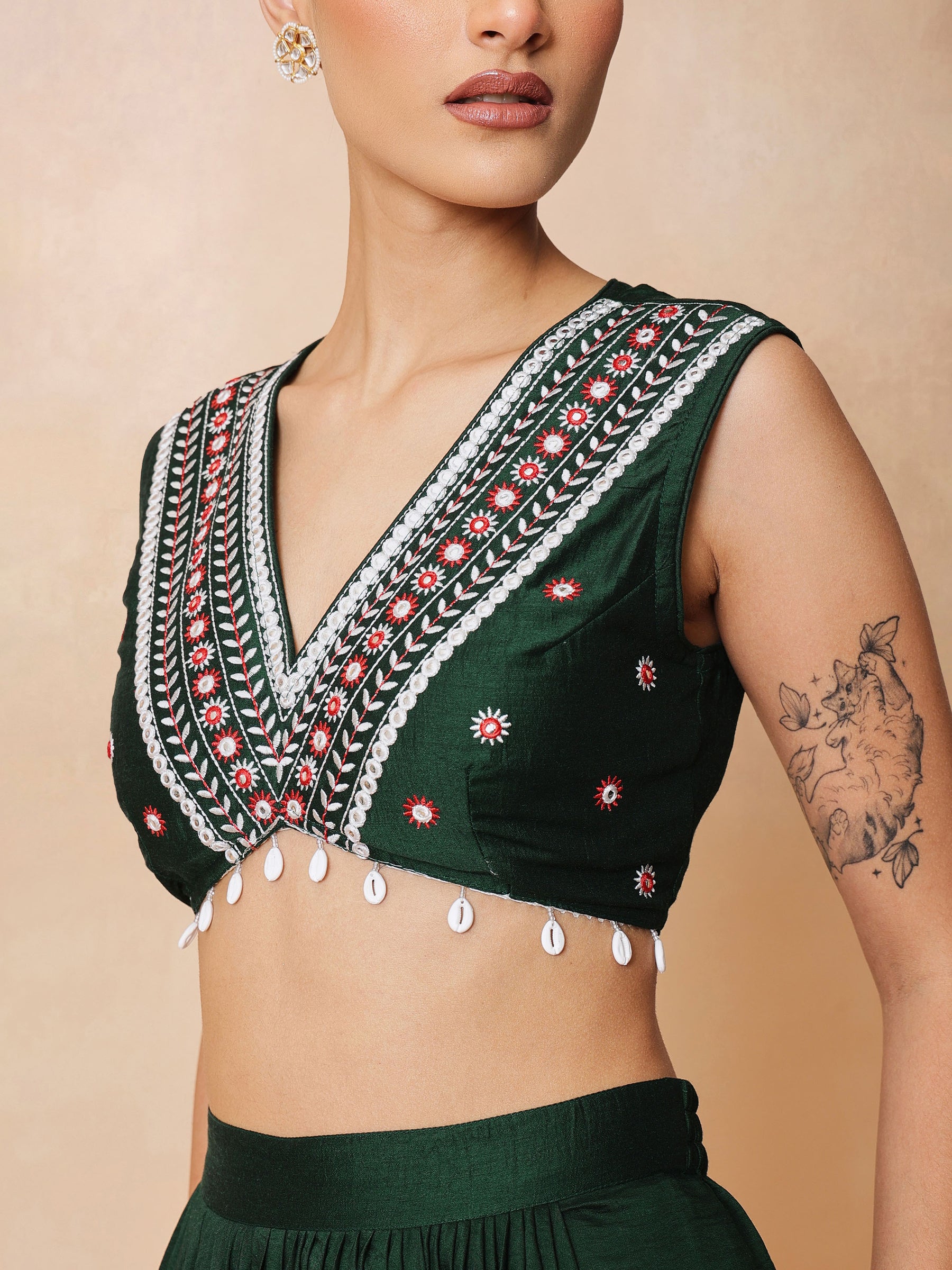 Emerald Green Embroidered Crop Top With Dhoti Skirt And Shrug-Shae by SASSAFRAS