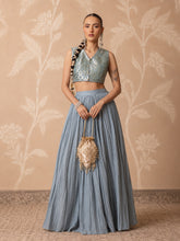 Women Powder Blue Brocade Sleeveless Crop Top With Pleated Skirt