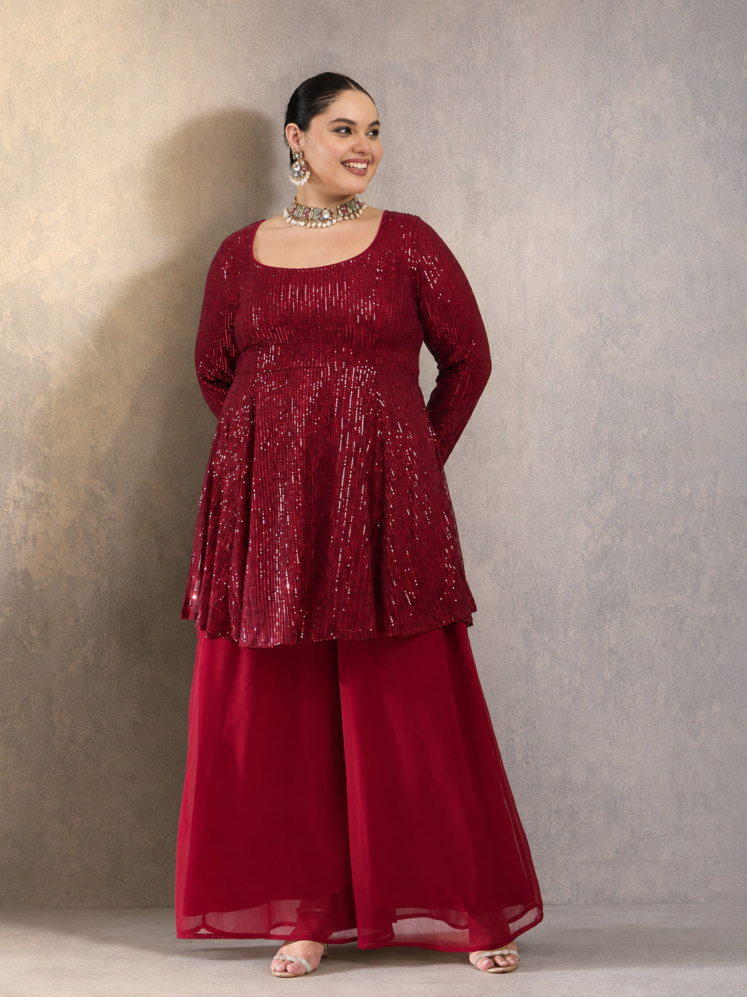 Maroon Sequin Full Sleeves Peplum Top With Flared Pants -Shae by SASSAFRAS