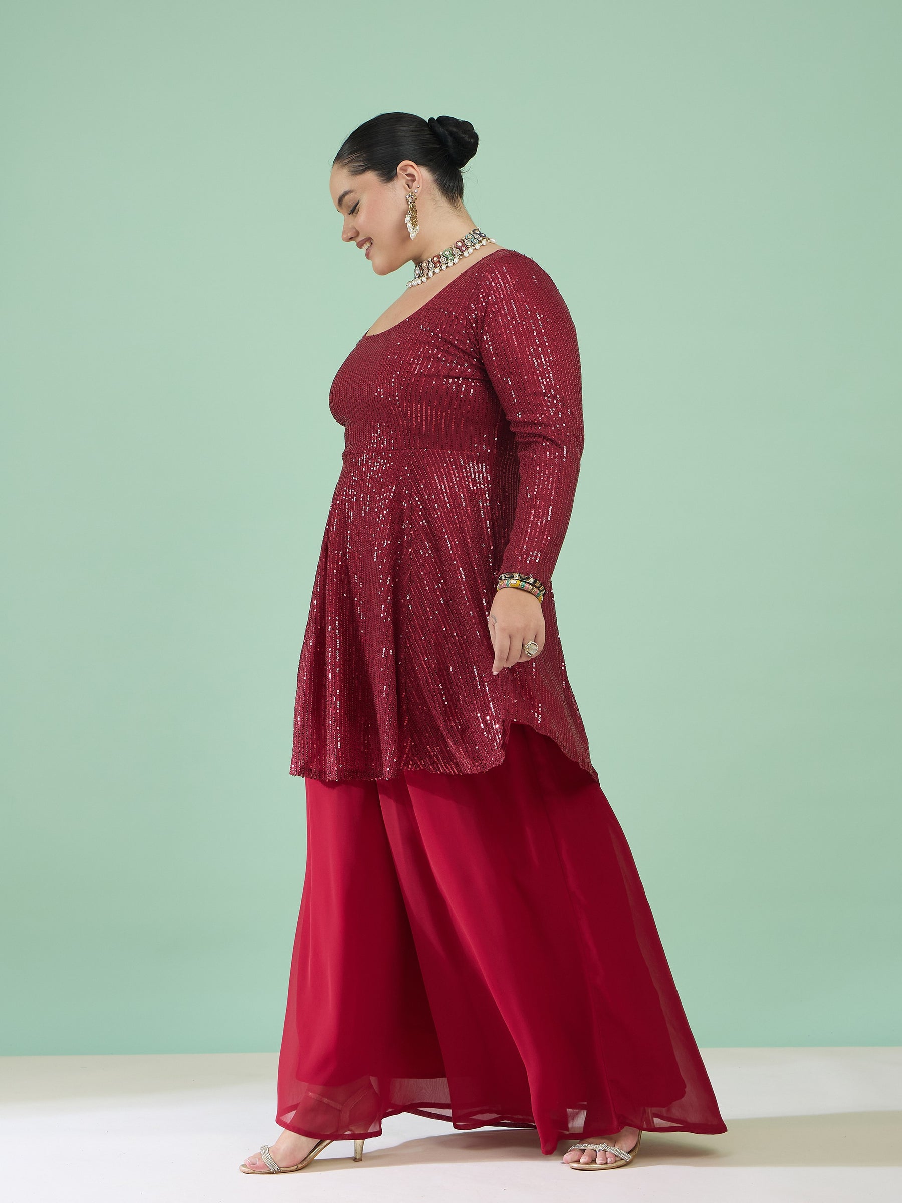 Maroon Sequin Full Sleeves Peplum Top With Flared Pants -Shae by SASSAFRAS