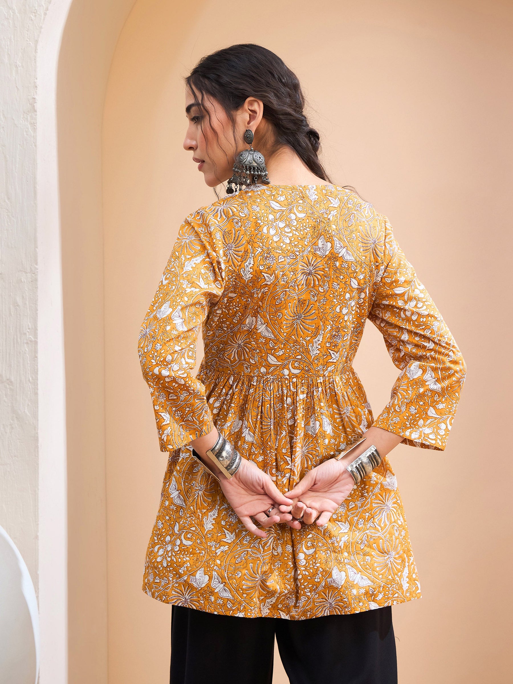 Yellow Floral Cambric V Neck Peplum Kurti -Shae by SASSAFRAS