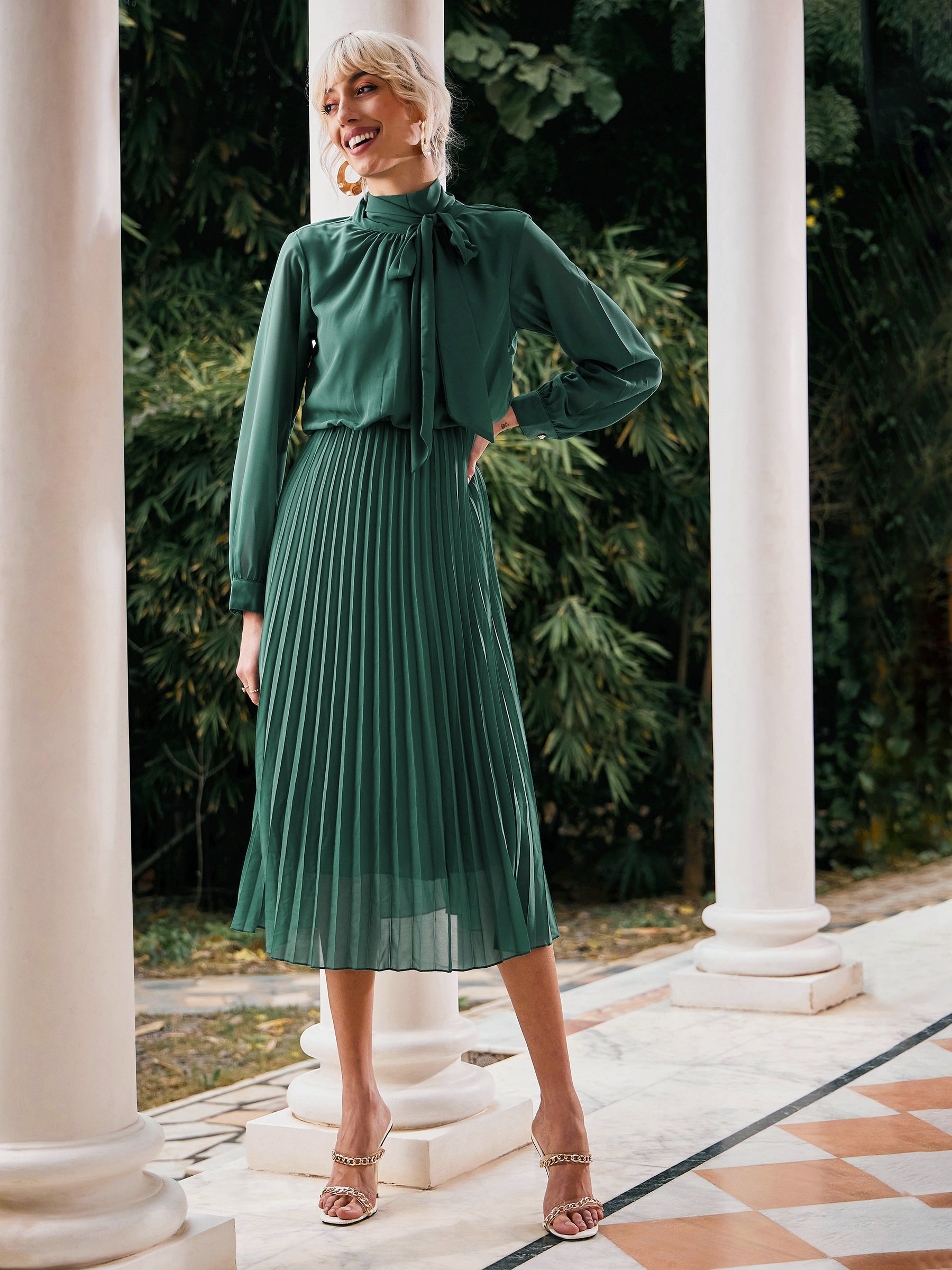 Buy Women Green Tie-Up Neck Accordion Pleated Dress Online at Best Price - Sassafras Buy Women Green Tie-Up Neck Accordion Pleated Dress Online at Best Price - Sassafras