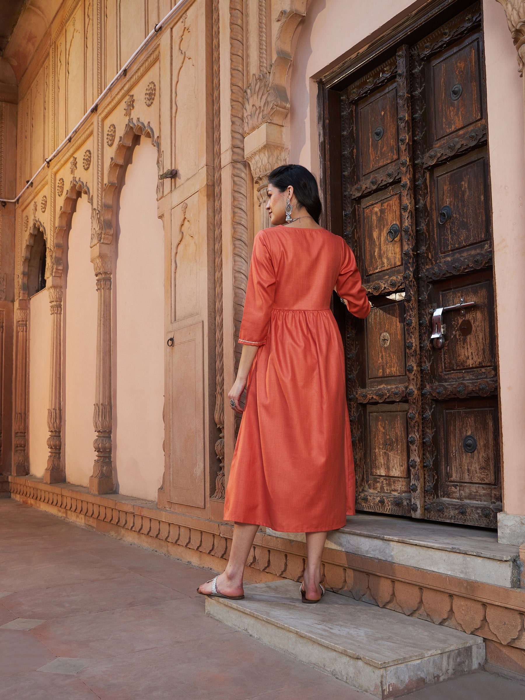 Rust Embroidered Slant Empire Seam Kurta-Shae by SASSAFRAS