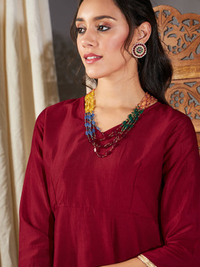 Maroon Zari Embroidered Peplum Top With Dhoti Pants-Shae by SASSAFRAS